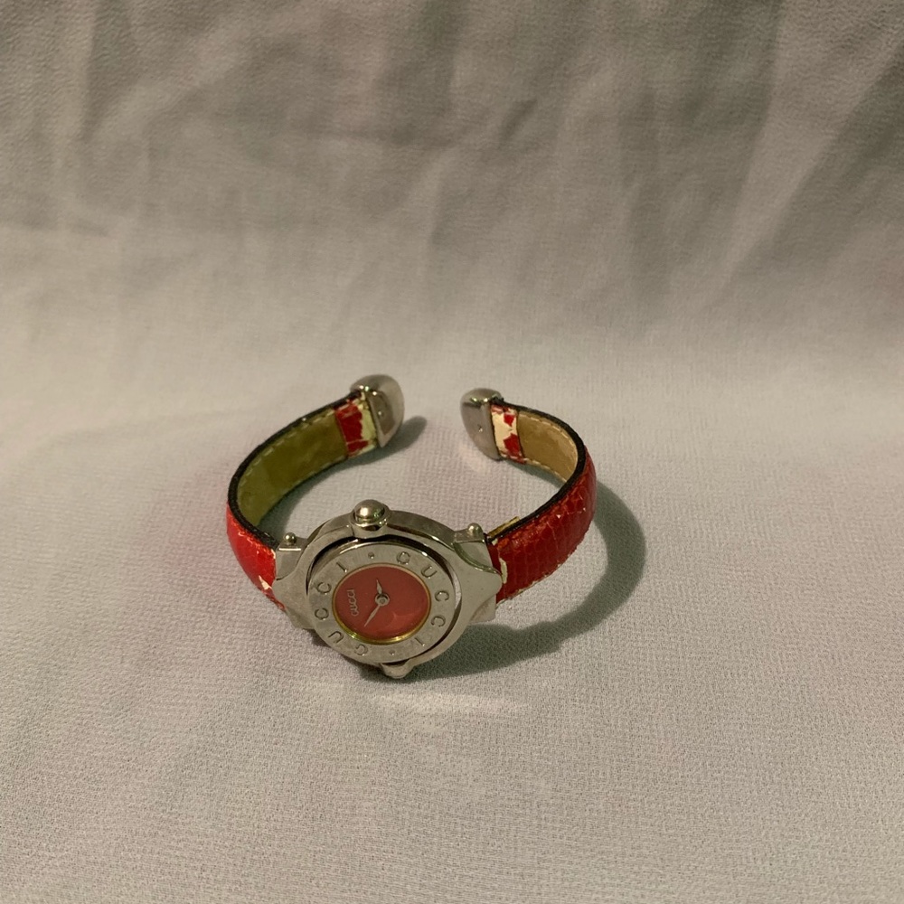 Gucci vintage watch with a red band.